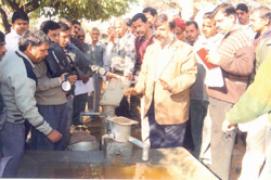 Hand pump with attachment for filling animal - Photo
